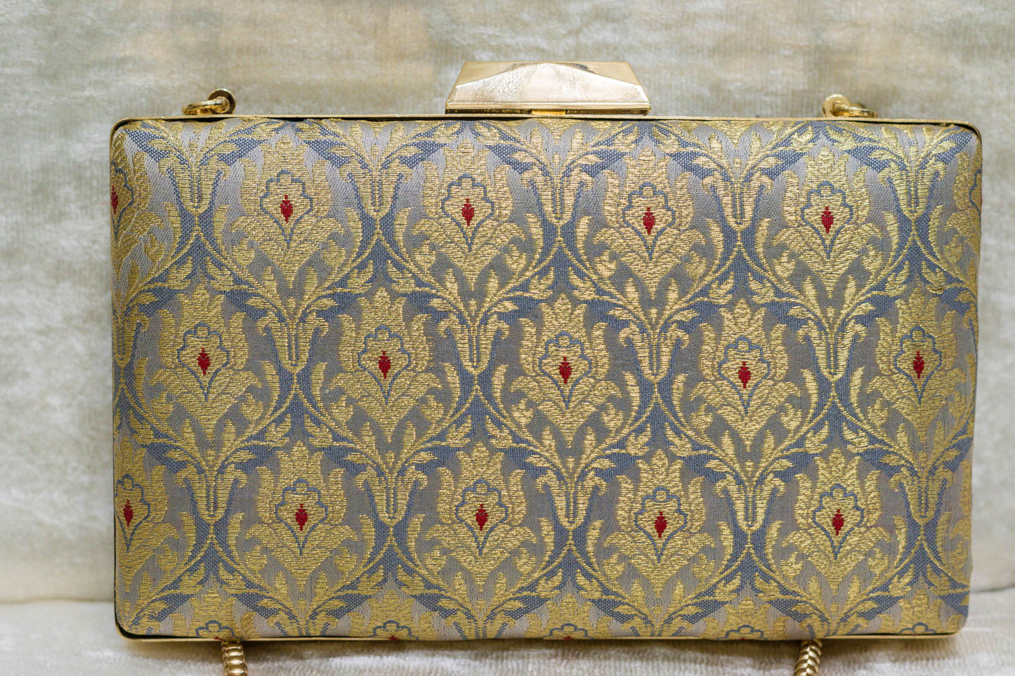 Steel blue Banarasi brocade clutch bag with traditional floral motifs, handmade elegance.