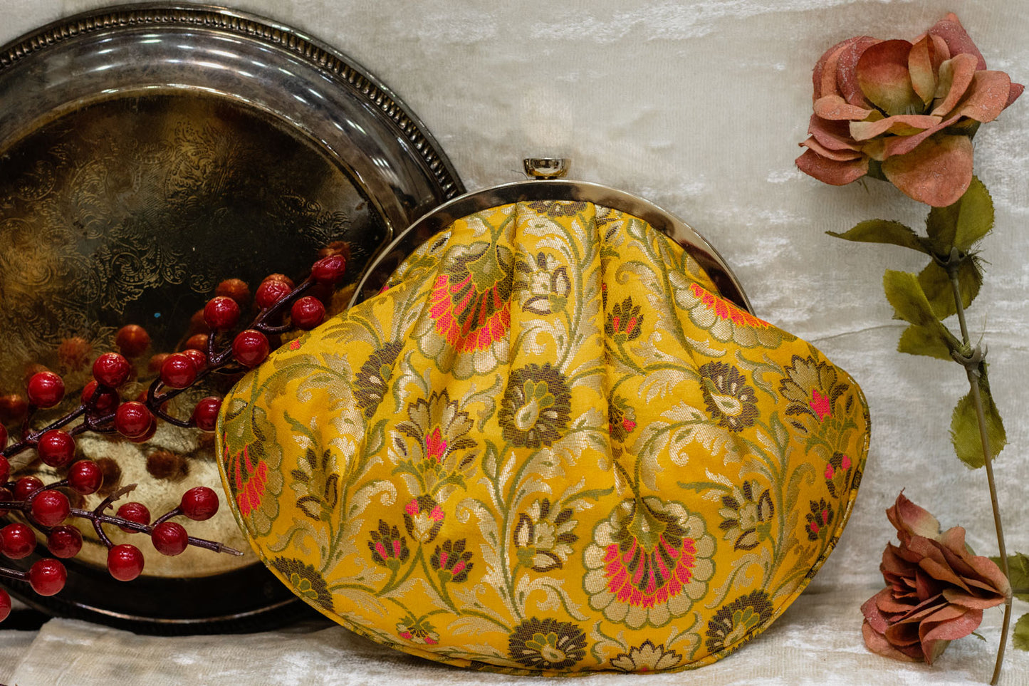 Yellow Banarasi brocade traditional clutch bag with floral embroidery, handmade design.