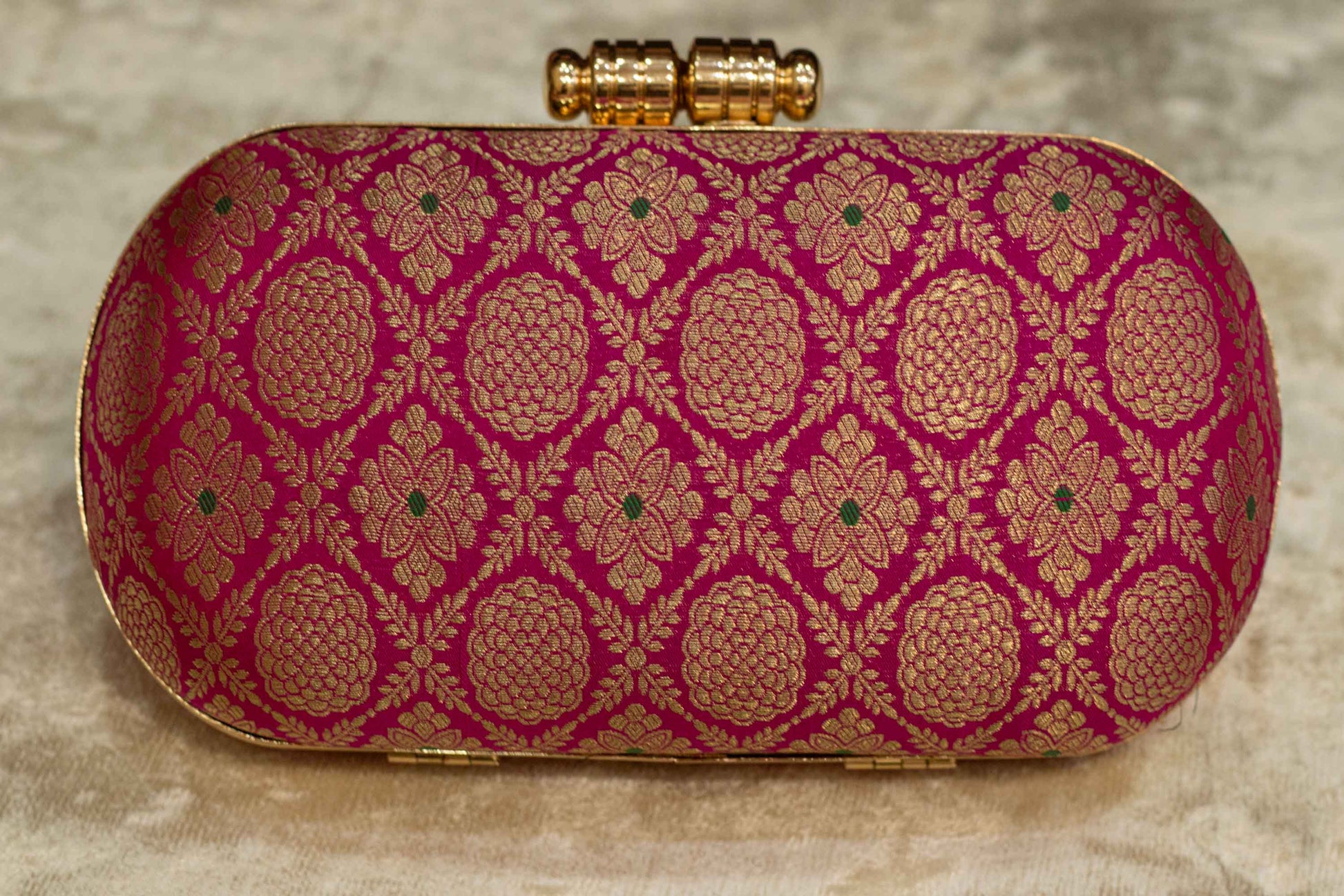 Rani pink Banarasi brocade clutch bag with traditional gold floral patterns, handmade capsule clutch.