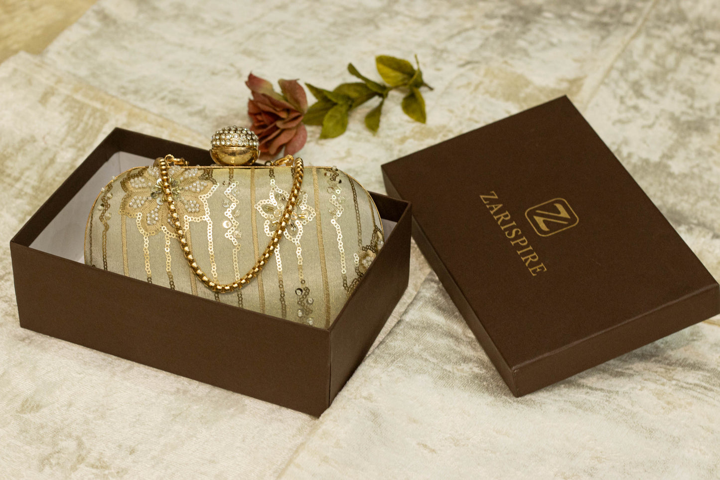 Sage green banarasi brocade clutch bag with gold floral embroidery and decorative pearl chain, handmade traditional clutch.