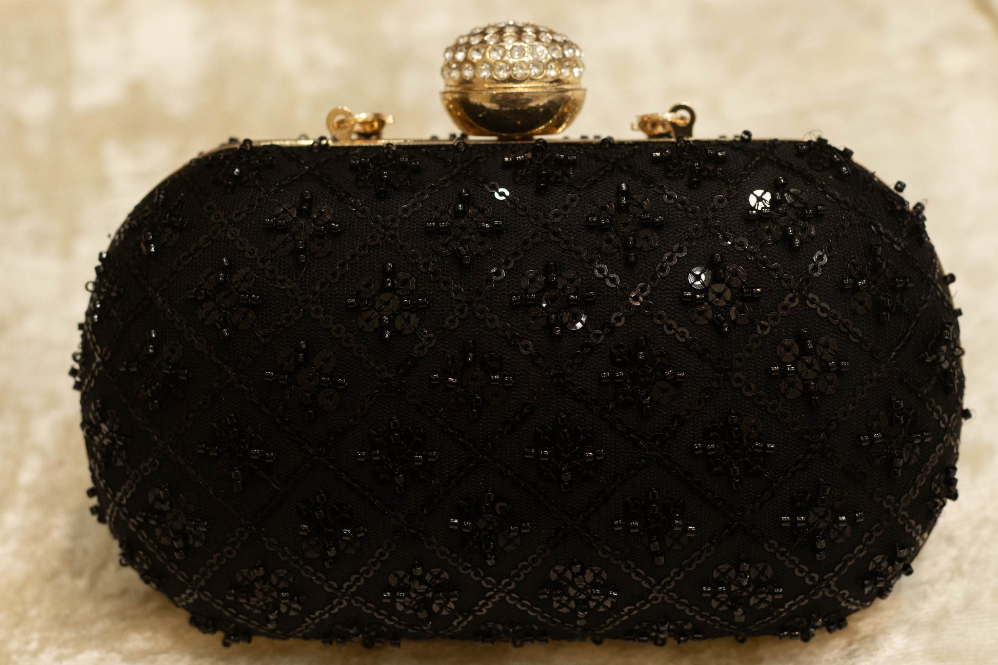 Black banarasi brocade clutch bag with intricate beadwork and decorative clasp, traditional handmade clutches.