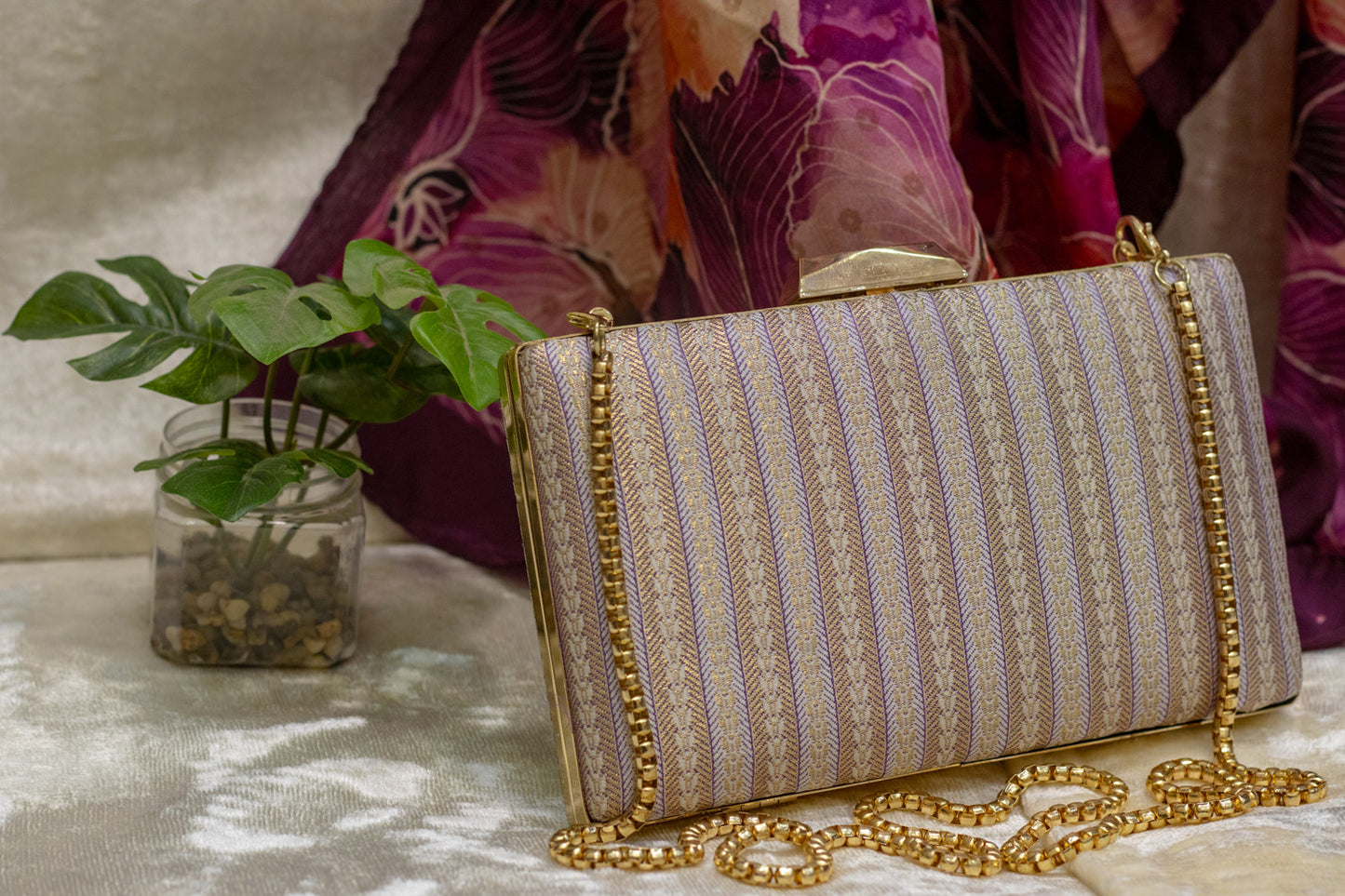 Mauve Banarasi brocade clutch bag with traditional gold chain, handmade detailing.