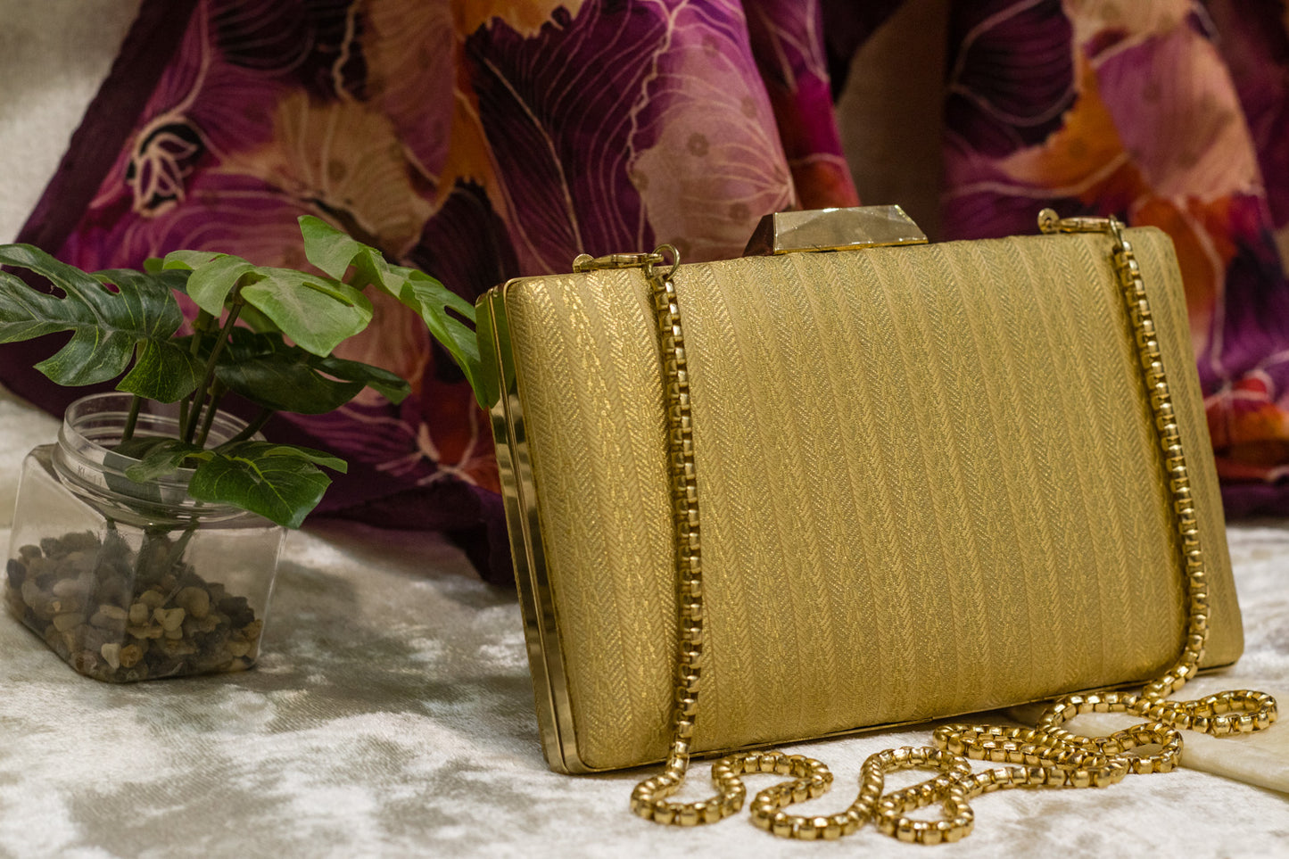 Beige traditional Banarasi brocade clutch bag with gold chain, handmade sleek design.