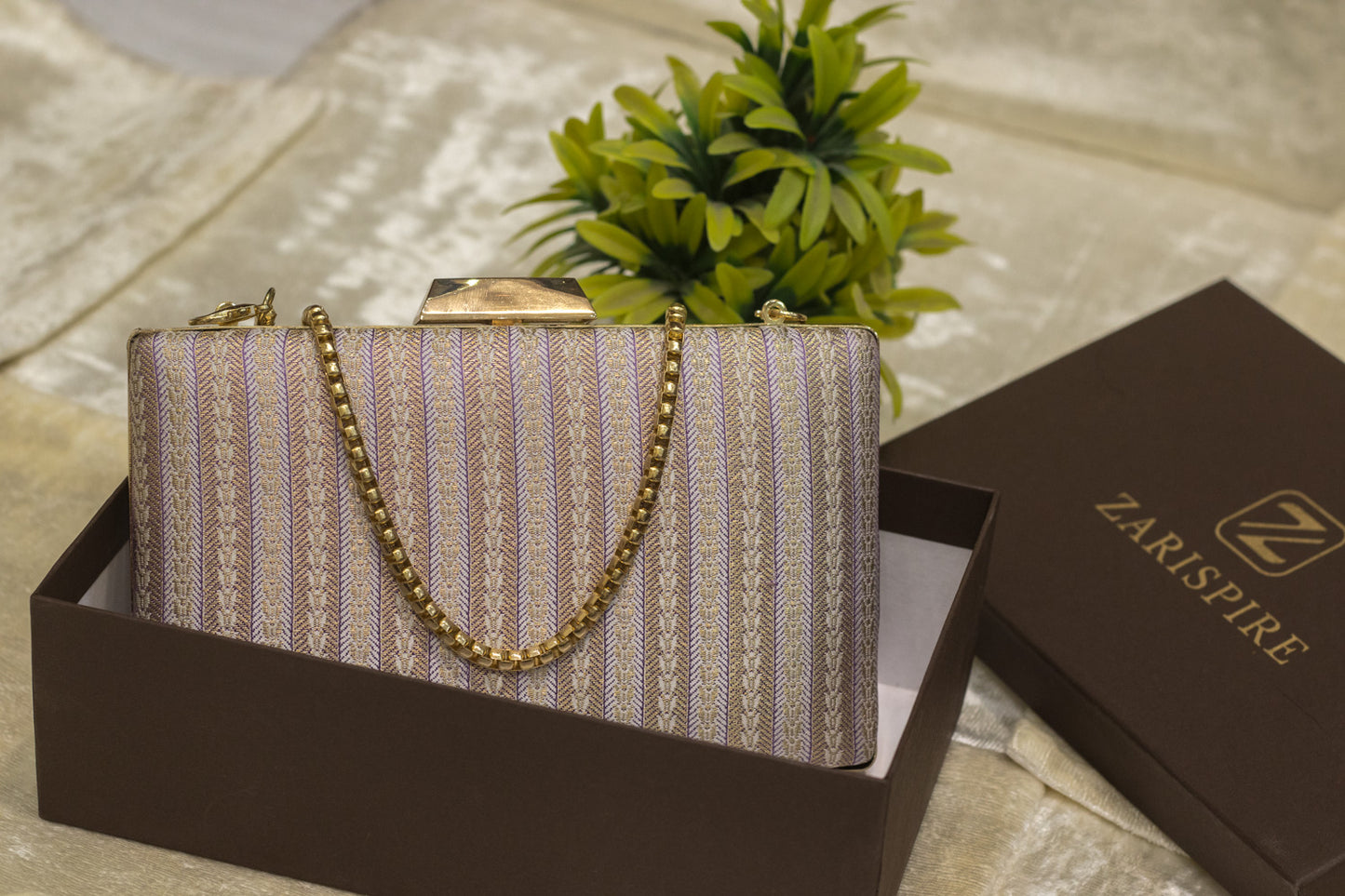 Mauve Banarasi brocade clutch bag with gold chain, traditional handmade design in gift box.
