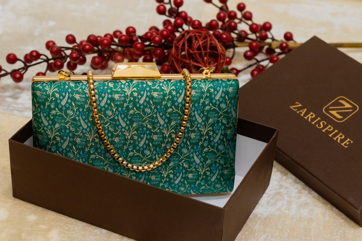 Teal Banarasi brocade clutch bag with gold chain and traditional floral pattern, handmade design.
