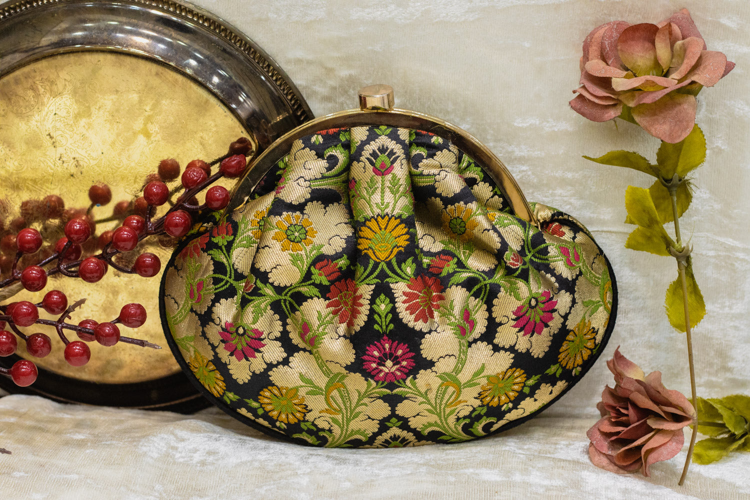 Black Banarasi brocade clutch bag with traditional floral embroidery, handmade detailing.