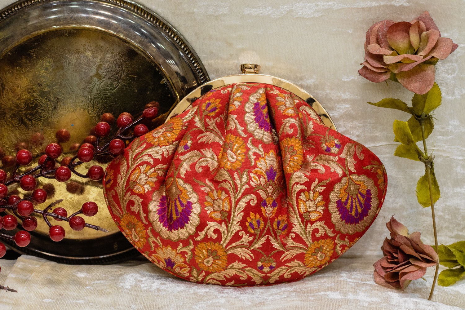 Red traditional Banarasi brocade clutch bag with intricate gold floral brocade, handmade design.