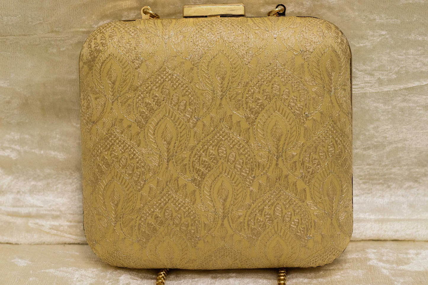 Beige traditional handmade brocade clutch bag with intricate banarasi floral patterns.