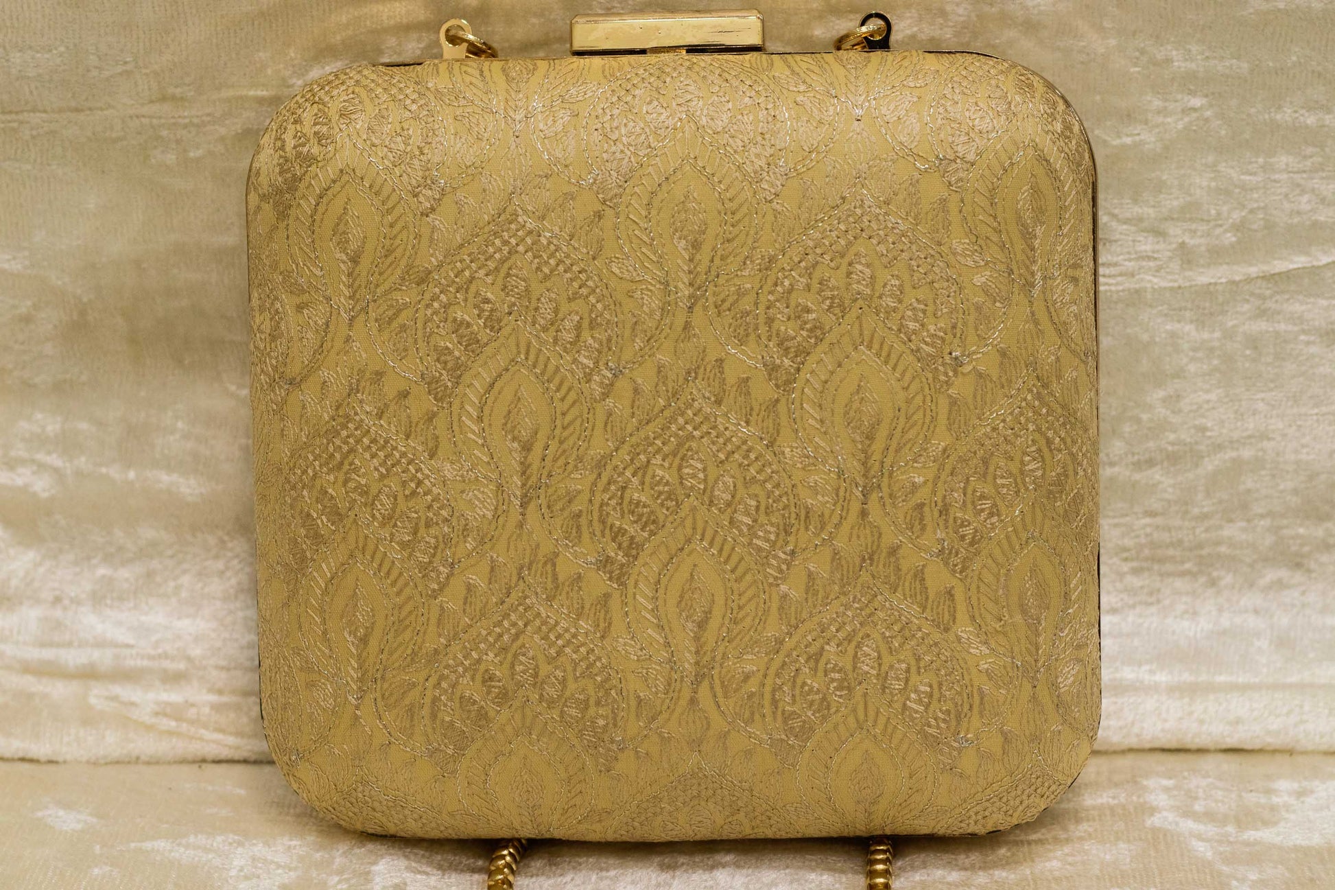 Beige traditional handmade brocade clutch bag with intricate banarasi floral patterns.